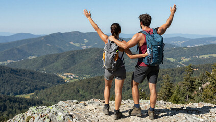 Active Gay Couple Hiking and Reaching Mountain Peak Together