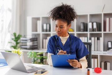 Nurse, young female doctor using laptop online, writing notes in medical journal sitting at desk, professional medic physician working on computer at workplace, med student learning, planning

