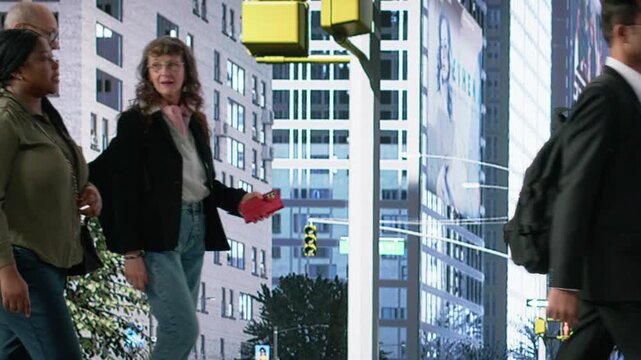 Illegal robbery shows black man stealing handbag on city on street, bystanders ignoring the assault and showing negligence in helping girl victim. Disconnection and phone dependency. Camera B.