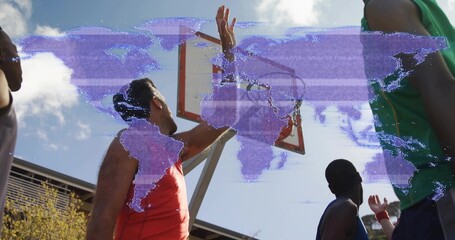 Jumping men reaching rim at outdoor court, wearing tanks and wristbands, purple world-map overlay