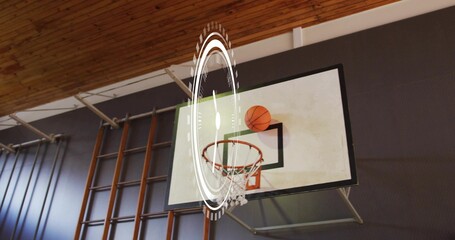 Showing basketball backboard and rim with ball perched in gymnasium, with AR HUD overlay