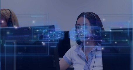 Answering calls, woman wearing blouse and headset monitoring screens at office, data overlays