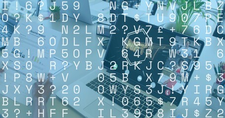 Showing laptop with team wearing business casual and slide at desk hand holding quarter report