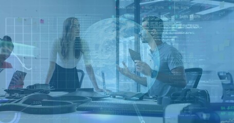 Discussing five colleagues reviewing drone frames on tablets in meeting room, in business casual