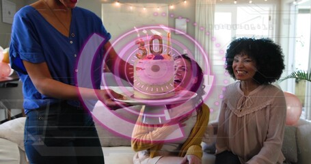 Presenting three friends reacting in living room while host carrying cake with 30 topper, overlay