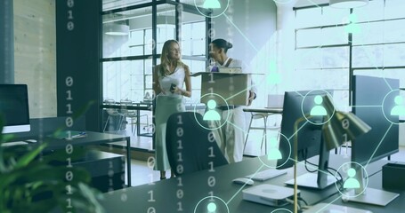 Walking coworkers talking in open office woman in white dress holding smartphone man carrying box