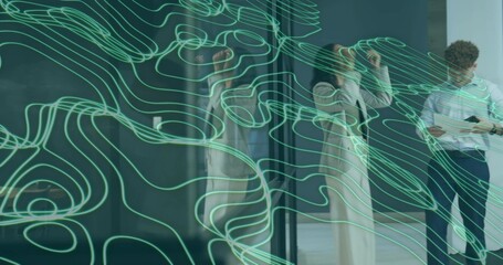 Adjusting woman in beige coat, colleague in white shirt checking tablet at glass with green lines