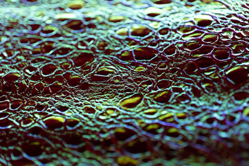 Crocodile faux leather.luminous leather texture.Animalistic wallpaper in holographic colors.Iridescent Crocodile Skin.Metallic shiny crocodile leather.Macro Shot of Crocodile Skin Texture.