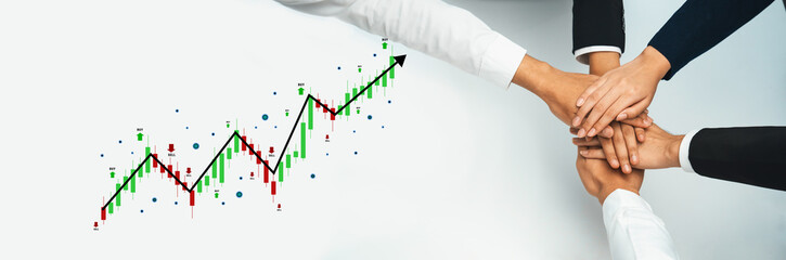 A powerful image depicting business teamwork with hands joined together, symbolizing unity and partnership, while a graphical chart shows a strong growth trend. Trope