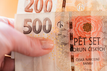 Czech crown banknotes in hands, close-up. Monetary currency of the Czech Republic. currency of the country is the Czech Republic. Hands count Czech money. Cash crown banknotes close-up. 