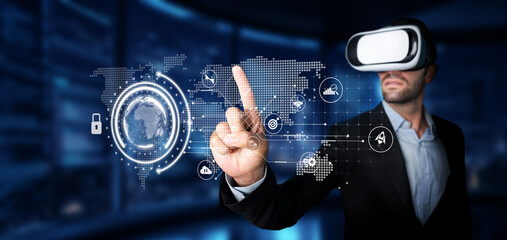 A businessman in virtual reality gear interacts with digital data analytics in a contemporary office, showcasing innovative strategies for investment planning and performance metrics. XDMCP