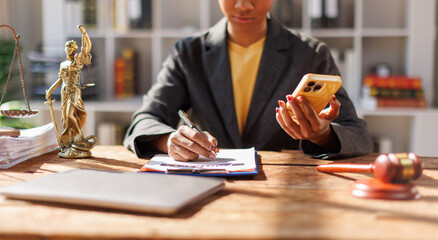 African American Lawyer woman afro hair with Lawyer or judge working with paperwork on his desk in...