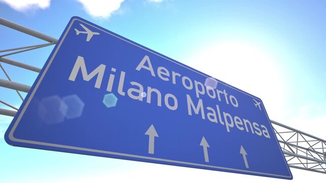 Bright blue motorway indicator toward Milan Malpensa Airport with passenger jet rising toward the horizon, departing from Milan, Italy.