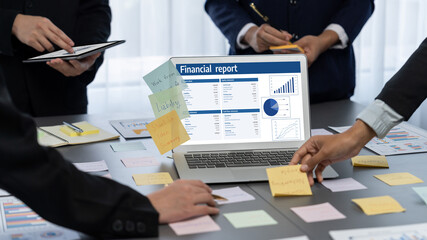 Analyst team use sticky note for creative and analytic brainstorm for business idea with BI data dashboard on laptop screen. Analysis financial data visualization tech for marketing strategy. Prodigy