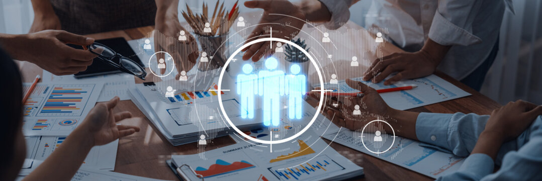 Team members engage in a collaborative meeting with digital tools. The image showcases hands working together, highlighting teamwork and communication in a business environment. Trope - Powered by Adobe