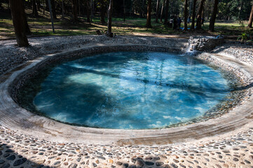 Public pool in Huai Mak Liam hot spring in Chiang Rai province of Thailand. Hot springs are naturally occurring spring of water that is warmed by heat within the Earth.