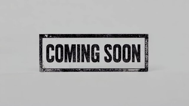 Coming soon sign with bold text on neutral background  