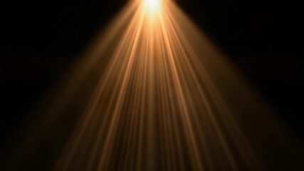 Golden light rays shining through darkness, creating a dramatic and inspiring effect