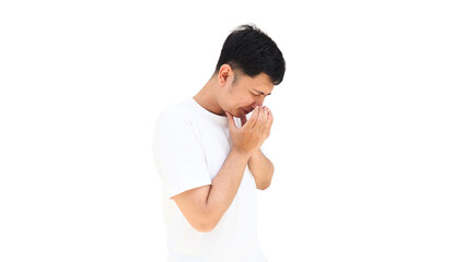 Side view of a young man coughing into his hands. He looks unhealthy and is trying to stop the spread of virus or bacteria. Ideal for medical concepts regarding contagious diseases or the common cold.