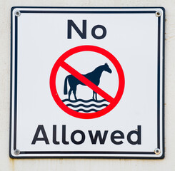 no horses allowed in water &mdash; prohibition sign