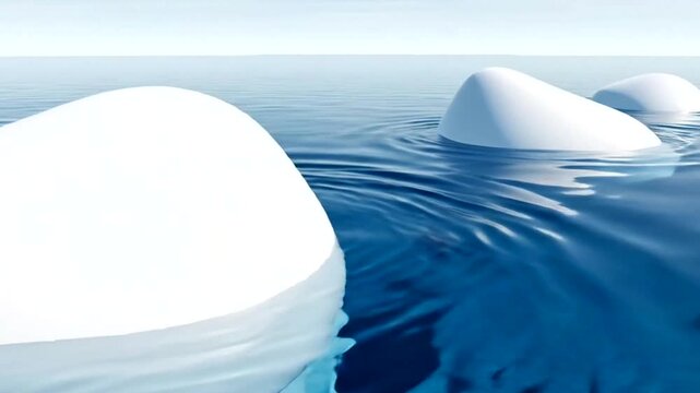 Icebergs floating in the ocean water.