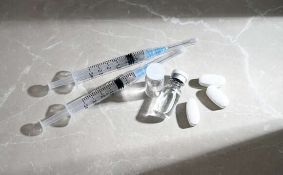 Glass Vials Peptide Compounds and Single Use Syringes Next to Weight Loss Pills