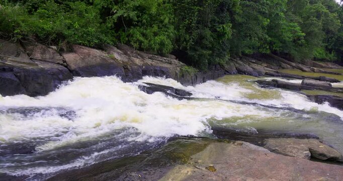 Wild River Rapids Flowing Over Rocky Riverbed in Sinharaja Rainforest, Sri Lanka