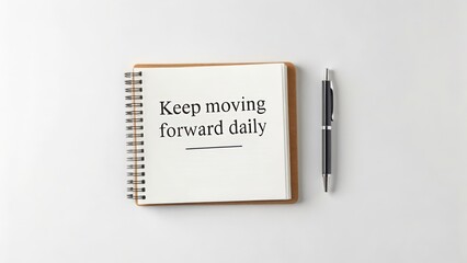 Open Notebook With Motivational Quote and Pen
