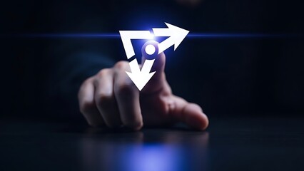 hand pointing to rotating arrows icon on dark surface with blue light  technology concept