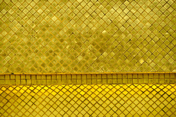 Textured Pattern of Golden Tiles with Geometric Diamond Design