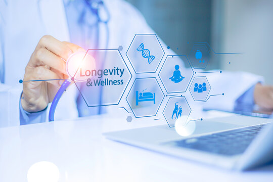 Doctor holding virtual wellness and longevity interface with health, lifestyle and medical icons.wellness and longevity preventive healthcare Concept. medical innovation and healthcare technology.