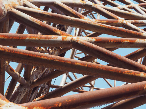 Large rusted steel structure showing raw industrial strength and weathered texture. The corrosion and rough metal surface tell a story of time, decay, and resilience. 