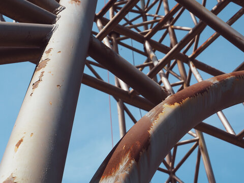 Large rusted steel structure showing raw industrial strength and weathered texture. The corrosion and rough metal surface tell a story of time, decay, and resilience. 