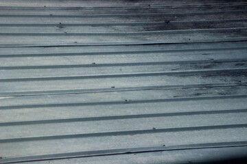 Obraz premium corrugated light steel roof made from a mixture of aluminum, zinc and silicon.
