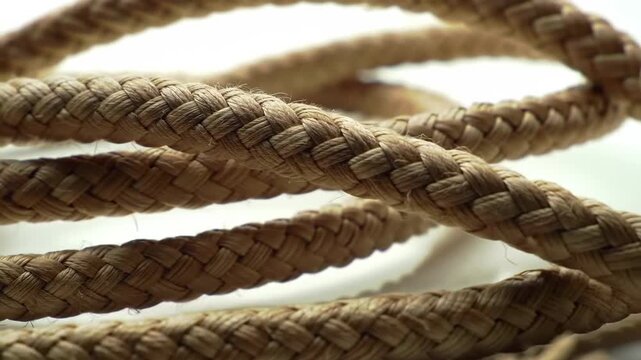 Close-up of a coiled natural fiber rope, showcasing its texture and pattern.