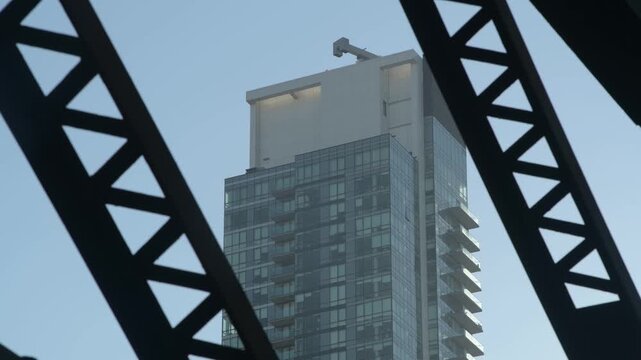 Sitcom Style Establishing Shot of NY Apartment or Skyscraper from under Bridge