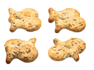 four fish-shaped savory crackers with sesame and sunflower seeds, golden baked and crispy, isolated on a white background.
