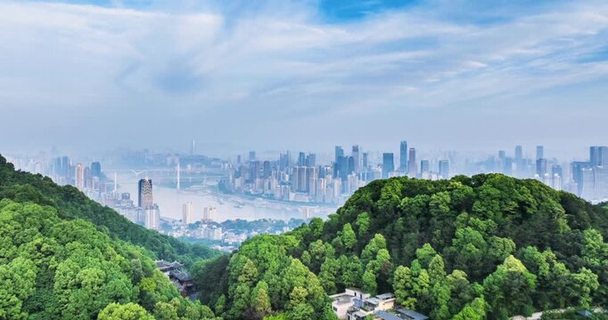 Aerial time-lapse of Chongqing skyline from Nanshan mountain area, lush green hills with Taoist temple meeting the cityscape along rivers and bridges, China.