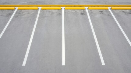 Fototapeta premium Minimalist overhead view of empty parking bays with yellow curb and white lines