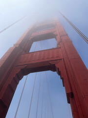 Fototapeta premium Golden Gate Bridge Tower Against Foggy Sky