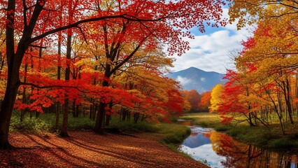 Vibrant autumn forest with a serene river and mountain backdrop.