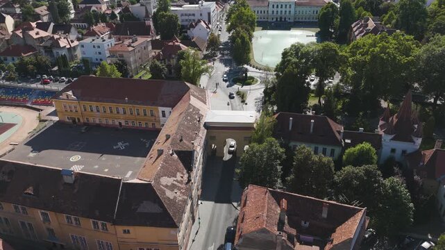 Aerial view highlighting the Șchei Gate and surrounding historic streets in Brașov&rsquo;s old town.