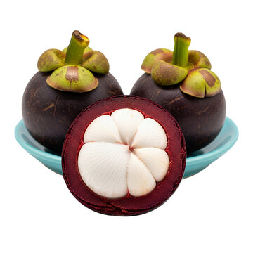 Fresh mangosteen fruits on a blue bowl, white background isolated