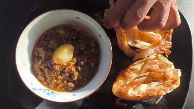 Roti with goat curry , Traditional Asian food.