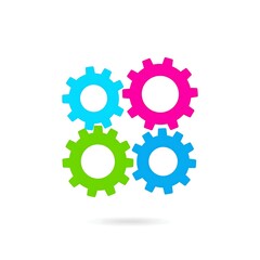 Fototapeta premium Four colorful interlocked gears, teal, pink, green, and blue, forming a symbol of teamwork