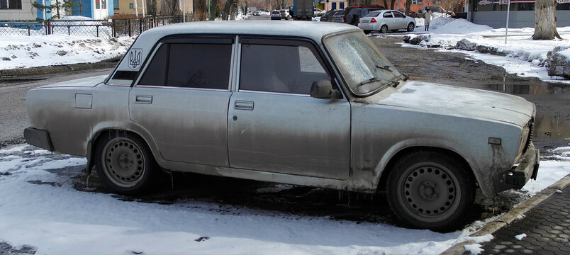 Kazakhstan, Ust-Kamenogorsk, march 11, 2024: Old Soviet car VAZ 2107 Semerka, Zhiguli. Retro car VAZ 2107 parked. Spring snow
