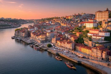 Obraz premium Panoramic view of a European coastal city at sunrise, with colorful buildings and a river