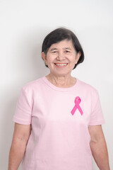 Elderly woman with pink Ribbon for Pink October Breast Cancer Awareness month, May Women Health, February World cancer day, support people life and illness. National cancer survivors month