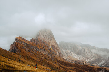 Scenic landscape view of the Dolomites Alps featuring the Odle mountain range and Seceda peak in Italy. Captures dramatic alpine scenery,