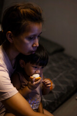 Overhead Shot Mom And Toddler Are Eating Santol.